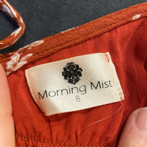 Burnt orange floral romper with ruffles and crisscross back (adjustable) - Picture 7 of 7